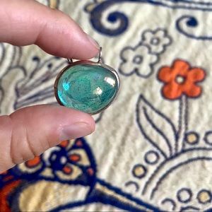 Slightly opalescent blue glass pendant with silver